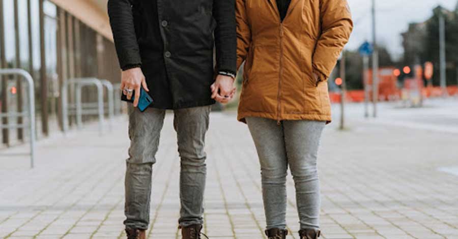 man and woman holding hands